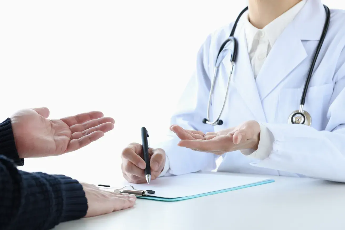 Plastic surgeon and patient during a double eyelid surgery consultation