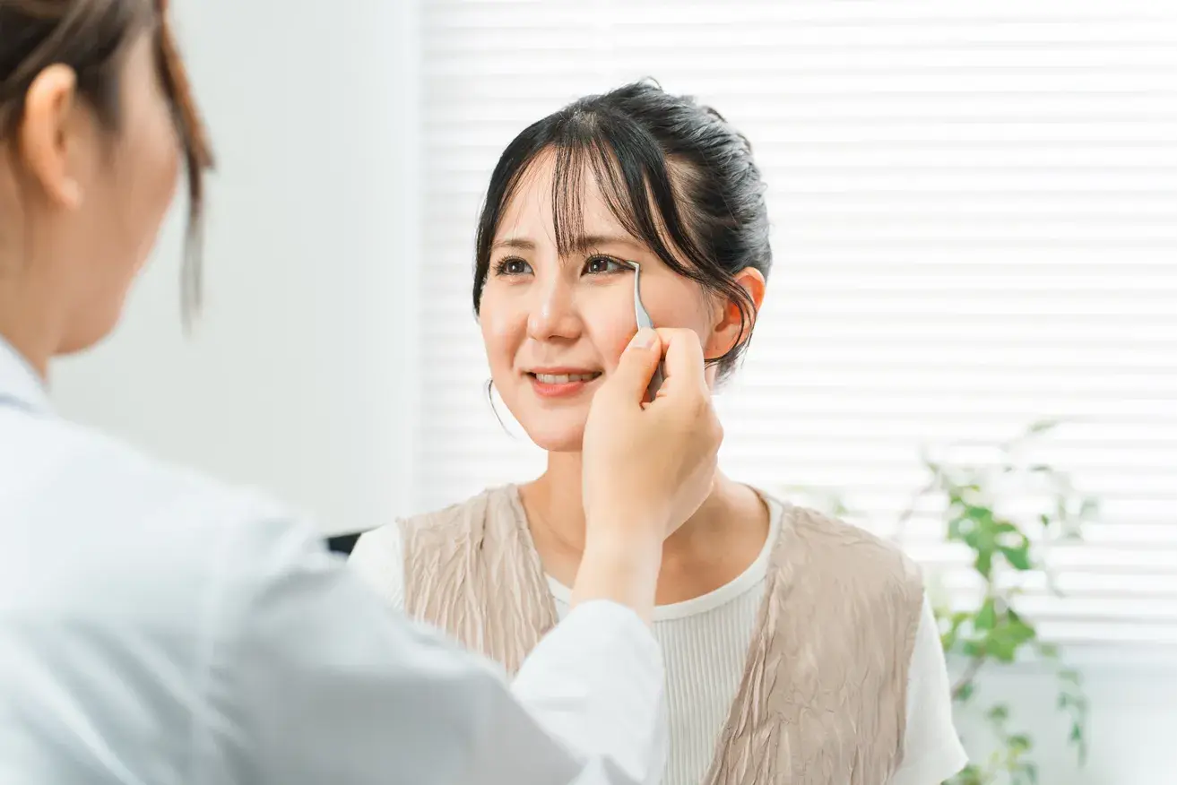 Doctor examining a patient's upper eyelids