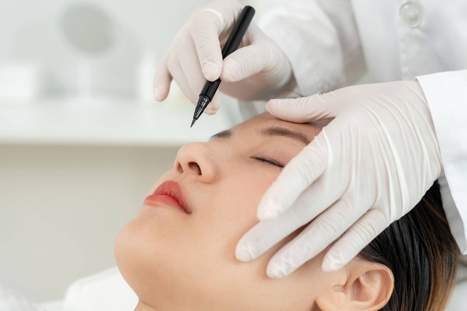 Woman undergoing rhinoplasty planning with a plastic surgeon.