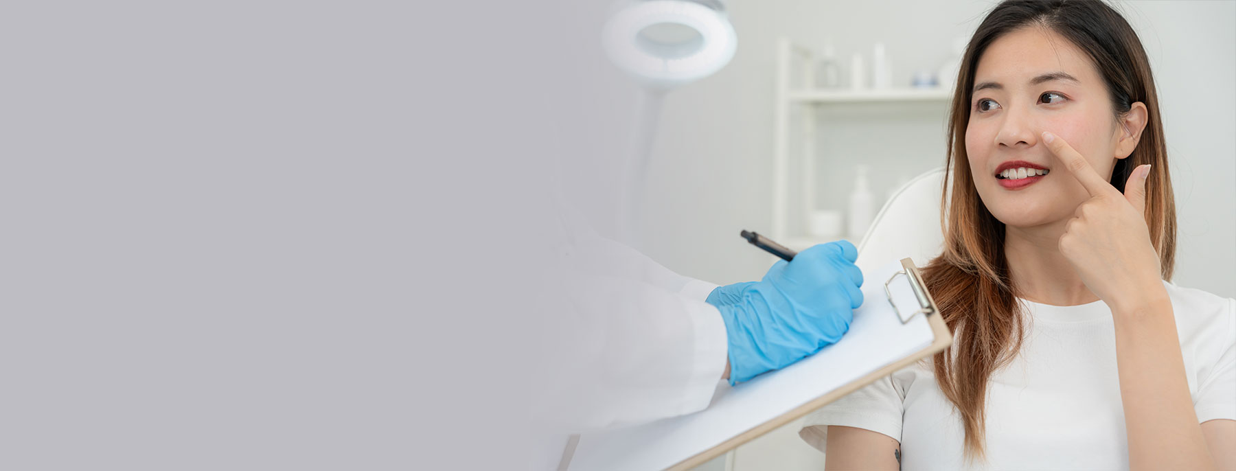 Woman attending a rhinoplasty consultation with a plastic surgeon.