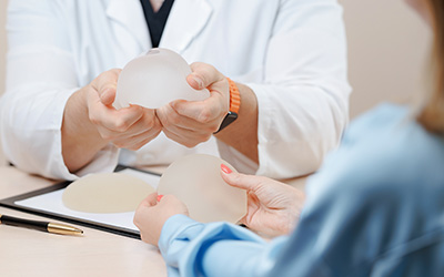 Woman attending a plastic surgery consultation while discussing treatment options.