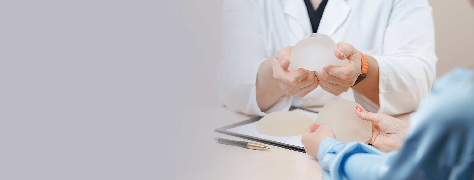 Woman attending a plastic surgery consultation while discussing treatment options.